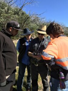 Staff members from Gunaikurnai Land and Waters Aboriginal Corporation (GLaWAC), East Gippsland Catchment Management Authority (EGCMA) and Taungurung Clans Aboriginal Corporation (TCAC) discuss the use of GPS marking for weed control