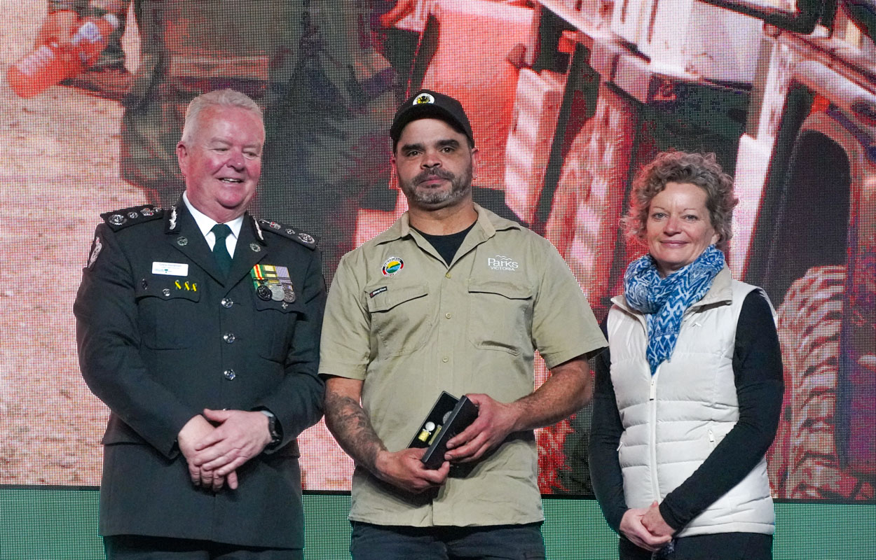 Mick Farning being presented with National Fire Medal.