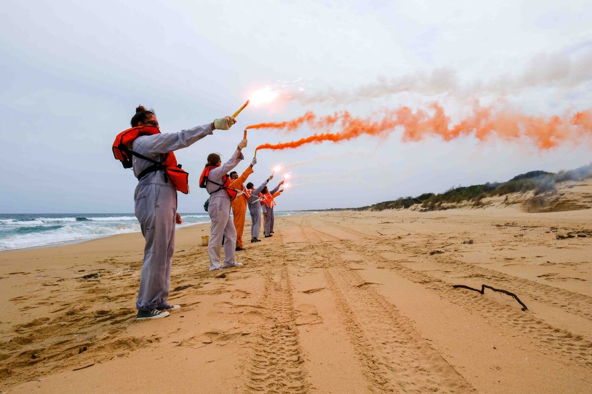 GLaWAC Rangers holding flares on a beach